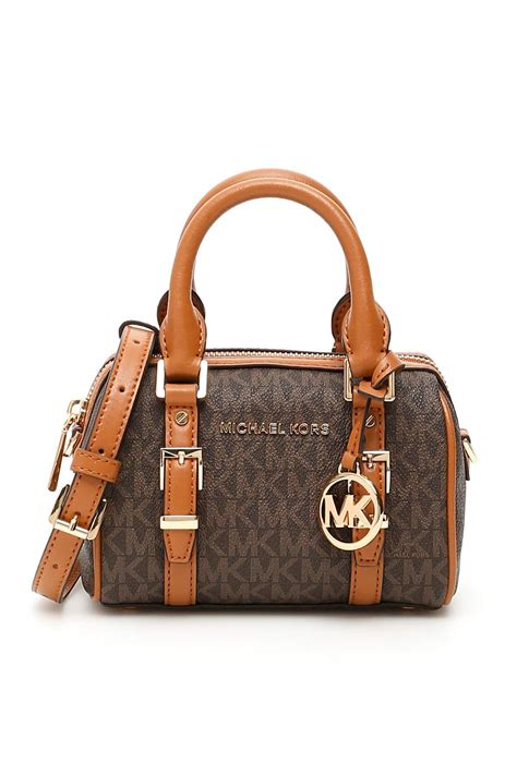 woman with michael kors bag|Michael Kors handbags official site.